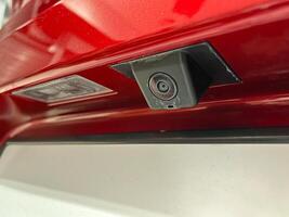 Rear view camera with washer installed on the car photo