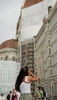 A tourist is in awe of the architectural beauty of a historic cathedral while on a journey video