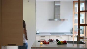 A modern kitchen with minimalist design, abundant natural light, creating a sleek stylish aesthetic video