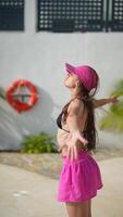 Woman in a stylish Pink Skirt enjoying a relaxing moment at the Poolside on a beautiful Sunny Day video