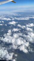 Breathtaking view of landscapes and clouds from the airplane window high in the sky video
