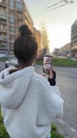A young woman in the city captures a moment with her smartphone, embodying modern urban lifestyle video