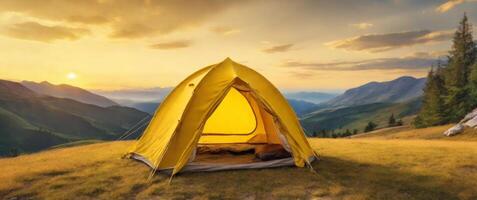 small yellow tent in nature with beautiful view. photo