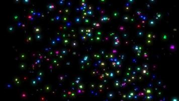 Confetti particles. Explosion and falling confetti on a black background. Background for holidays and birthday. Seamless loop video