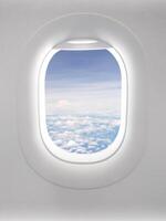 View of a clear sky with fluffy clouds in an open airplane cabin. photo