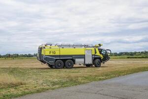 Hasselt. Limburg - Belgium 27-08-2022. Modern fire truck for use on airfields. Outdoor public show of vintage aircraft on the grass airfield at the Hasselt Aero Club photo