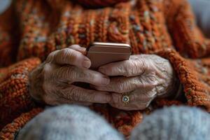Elderly Hands Holding Smartphone photo