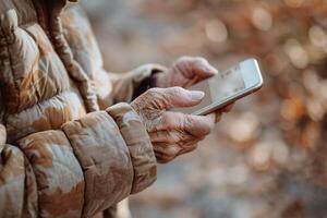 Elderly Hands with Smartphone photo