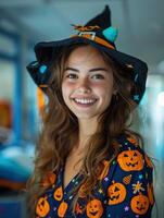 A cheerful young nurse dressed in a Halloween-themed witch costume photo