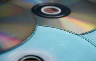 Groups of working and damaged DVD compact disk objects texture isolated on horizontal ratio background. photo