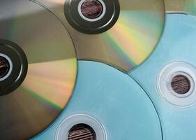 Groups of working and damaged DVD compact disk objects texture isolated on horizontal ratio background. photo