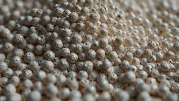 White PVC granulate background, recycled plastic granules, biodegradable plastic Granules of eco-friendly plastic raw material at the factory. photo