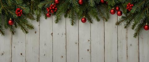 Christmas background pine leaves decoration on white wood plank, frame border design Merry Christmas and New Year holiday background top view. photo
