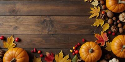 Happy Thanksgiving day background Autumn frame with pumpkins, fall leaves, berries, walnuts, acorns on wooden table Flat lay, top view, copy space. photo