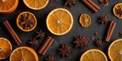 Frame of dried slices of orange, cinnamon sticks, anise stars Autumn fall poster design Flat lay, top view, copy space. photo