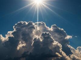 Sunlight breaks through cumulus clouds, illuminating the world below. photo