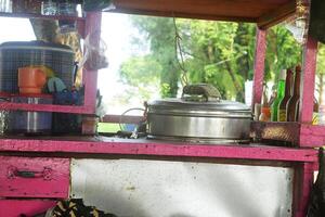 Carts of meatballs and several sachets of drinks used by traders to sell food photo