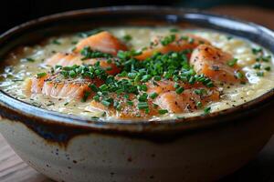 A bowl of Cullen skink, a Scottish smoked haddock soup, garnished with chopped chives. photo
