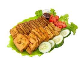 Tempe and Tahu Bacem, Indonesian Style Spice Seasoning with Sweet and Savory Taste from Java. Tempeh and Tofu Cooked with Various Spices and Palm Sugar isolated white background photo