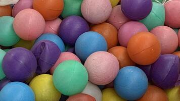 Colorful plastic balls as a background, close-up view. photo
