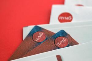 TERNOPIL, UKRAINE - JULY 7, 2023 Bank Card of PUMB Ukrainian Bank FUIB with red logo photo