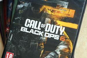 KYIV, UKRAINE - JUNE 26, 2024 Call of Duty Black Ops 6 PS5 game disc box for console gaming. Popular game disc photo