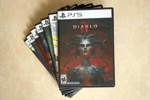 KYIV, UKRAINE - JUNE 26, 2024 Diablo 4 PS5 game disc box for console gaming. Popular game disc photo