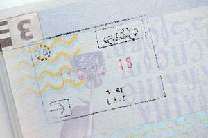 KYIV, UKRAINE - APRIL 20, 2024 Page of foreign passport with visas, Turkiye border stamps, permits to enter countries, concept of traveling around the world, travelers document photo