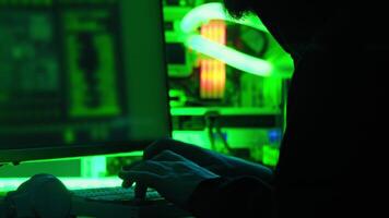 Close-up of the actions of a cyber criminal hacking into a computer system using a personal computer is shown. Cybersecurity. Close up. Slow motion. video