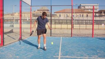 Young Boy Makes Serve With Padel Racket video