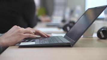Female hands of business woman professional user worker using typing on laptop notebook keyboard sit at home office desk working online with pc software apps technology concept, close up side view video