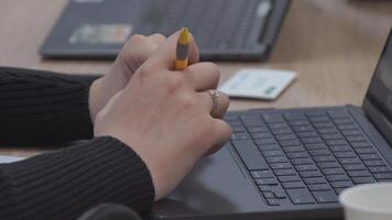 Female hands of business woman professional user worker using typing on laptop notebook keyboard sit at home office desk working online with pc software apps technology concept, close up side view video