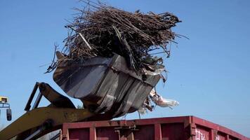 Industrial equipment for loading municipal solid waste into a container for processing and disposal video