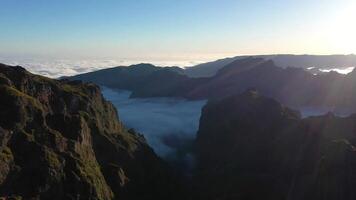 Pico do Arieiro. Mountain Peaks at Sunset. Cloud Inversion. Aerial View. Golden Hour. Madeira, Portugal. Moving Backwards and Upwards video