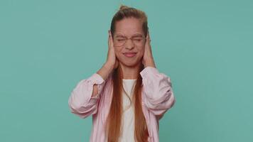 Frustrated irritated girl covering ears, gesturing no, avoiding advice ignoring noise loud voices video
