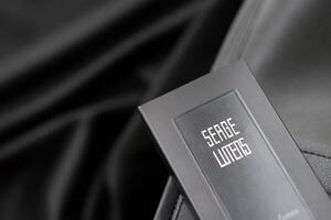 KYIV, UKRAINE - APRIL 20, 2024 Bottle of Serge Lutens Ecrin de Fumee perfume. Serge Lutens is a French perfume creator, known principally for the fashion house and fragrance company photo