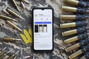 KYIV, UKRAINE - JUNE 20, 2024 Rezerv plus - ukrainian application for smartphone with actual personal information about conscript status for military recruits photo