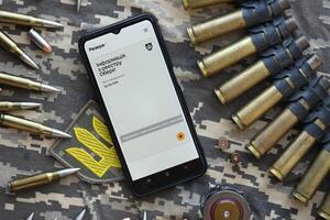 KYIV, UKRAINE - JUNE 20, 2024 Rezerv plus - ukrainian application for smartphone with actual personal information about conscript status for military recruits photo