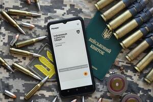 KYIV, UKRAINE - JUNE 20, 2024 Rezerv plus - ukrainian application for smartphone with actual personal information about conscript status for military recruits photo