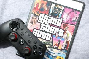 KYIV, UKRAINE - JUNE 26, 2024 Grand Theft Auto 6 PS5 game disc box for console gaming. Fictional fan-made game disc pack cover photo
