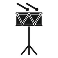 Snare drum standing on tripod with drumsticks lying on top vector