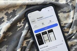 KYIV, UKRAINE - JUNE 20, 2024 Rezerv plus - ukrainian application for smartphone with actual personal information about conscript status for military recruits photo