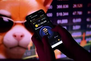 KYIV, UKRAINE - APRIL 20, 2024 Hamster Kombat telegram bot on smartphone screen. Hamster Kombat is a viral Telegram-based crypto game for earn HMSTR tokens by managing virtual crypto exchange photo