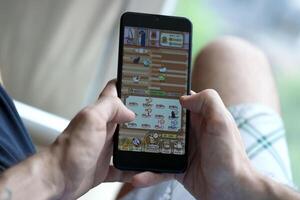 KYIV, UKRAINE - APRIL 20, 2024 Catizen telegram bot on smartphone screen. Catizen is a viral Telegram based crypto game for earn tokens by managing virtual crypto exchange photo