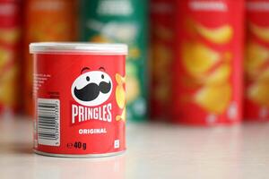 KYIV, UKRAINE - FEBRUARY 27, 2024 Pringles original potato chips on white background photo