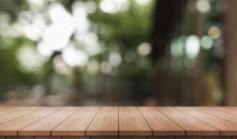 Empty wooden table top with lights bokeh on blur restaurant background. photo