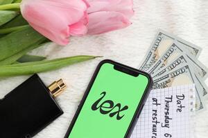 KYIV, UKRAINE - FEBRUARY 23, 2024 Lex logo of famous dating website or app on iPhone display photo