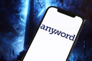 KYIV, UKRAINE - MARCH 17, 2024 Anyword logo on iPhone display screen with background of artificial intelligence futuristic image photo
