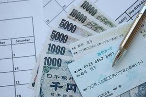 Japanese my number card specimen and notification card on calendar background with money photo