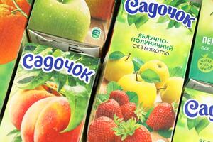 KHARKIV, UKRAINE - JANUARY 2, 2021 Sadochok various taste nectar from peach, apple and strawberry with orange flavour juice photo